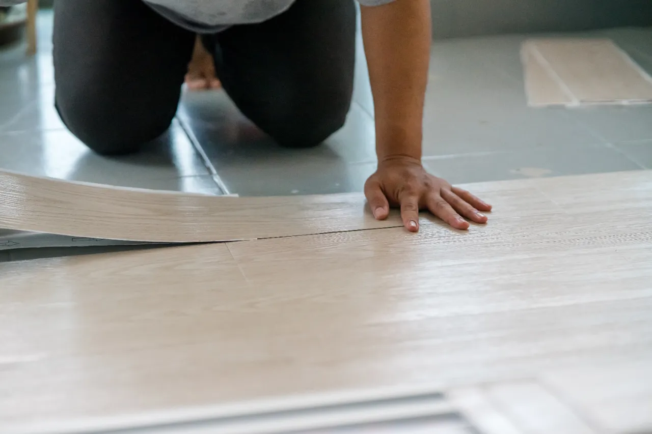 Installing new light colored vinyl flooring in a New Jersey home