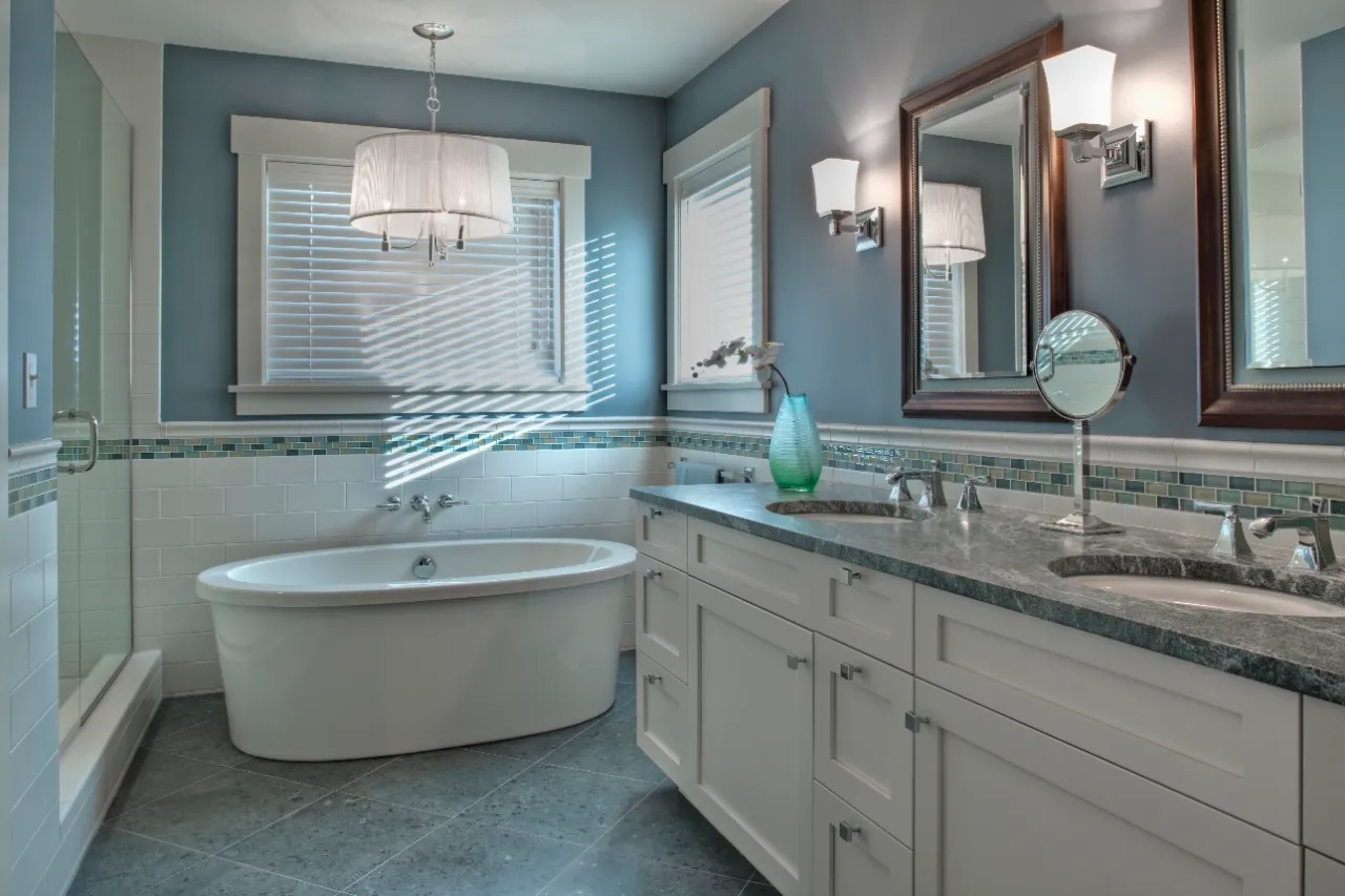 Modern bathroom remodel with bathtub and double vanity by Avelino Home Renovation in New Jersey